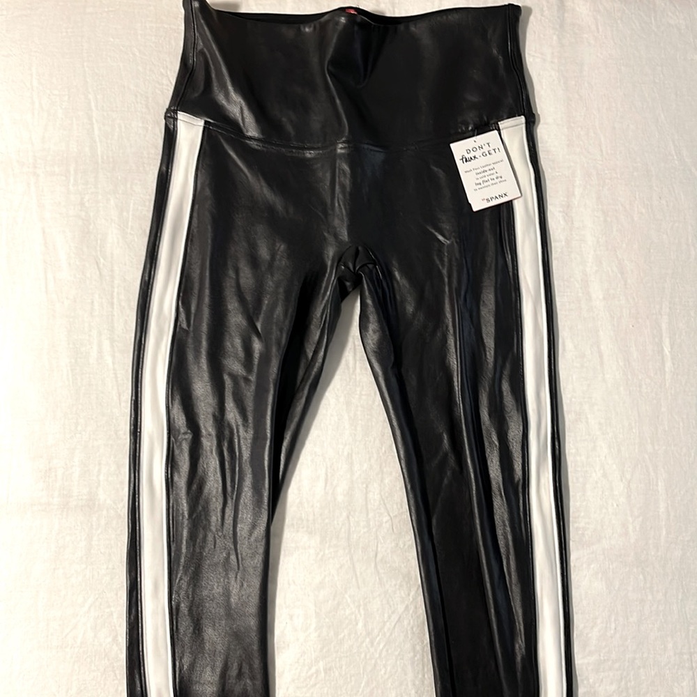 Brand new Spanx Faux leather leggings, white stripe, size large. Never been worn
